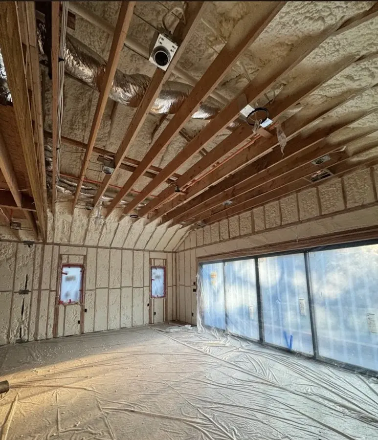 Interior walls and ceiling insulated with spray foam during new construction in North Bergen